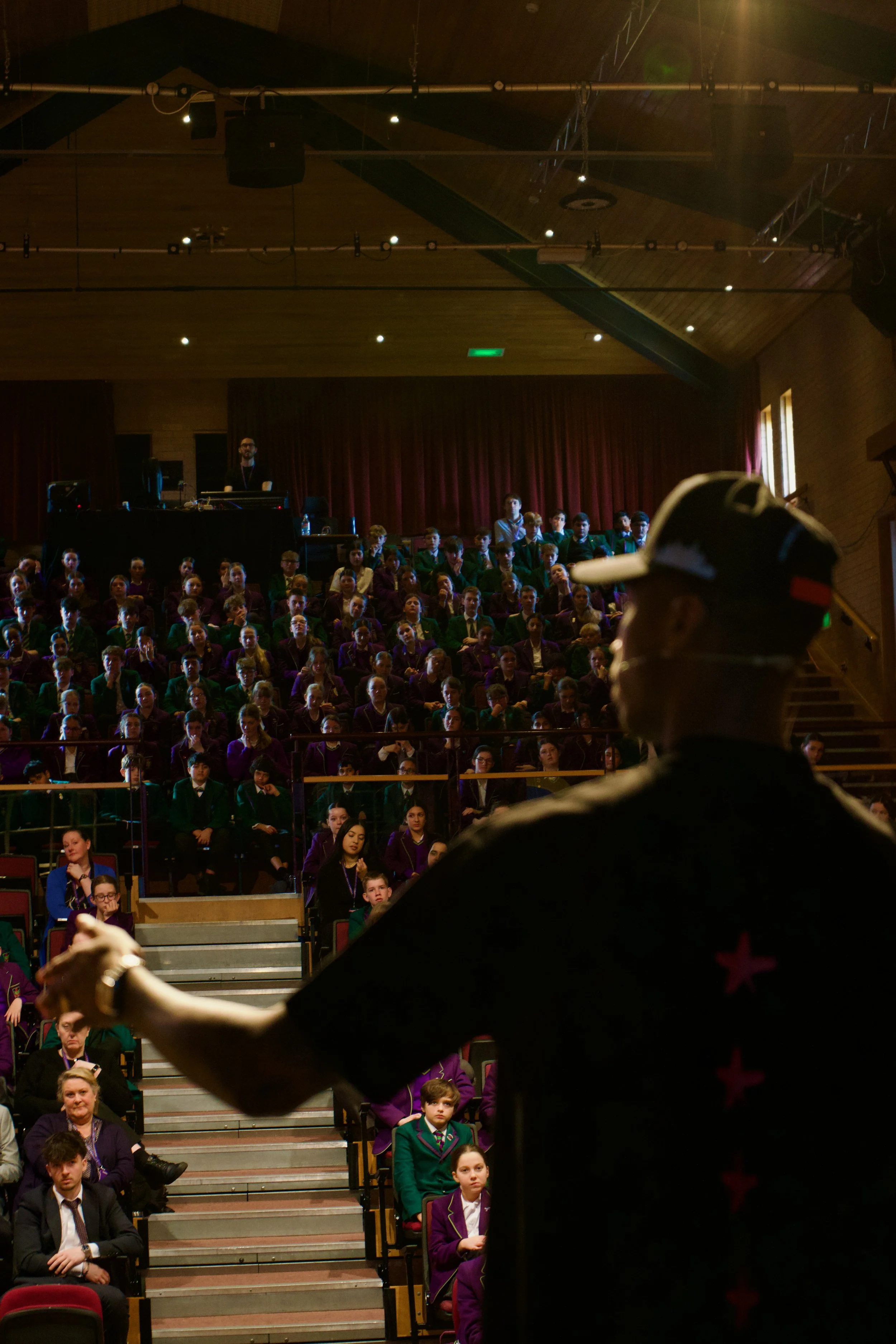 Kofi Josephs speaking to students in the Westholme School amphitheatre