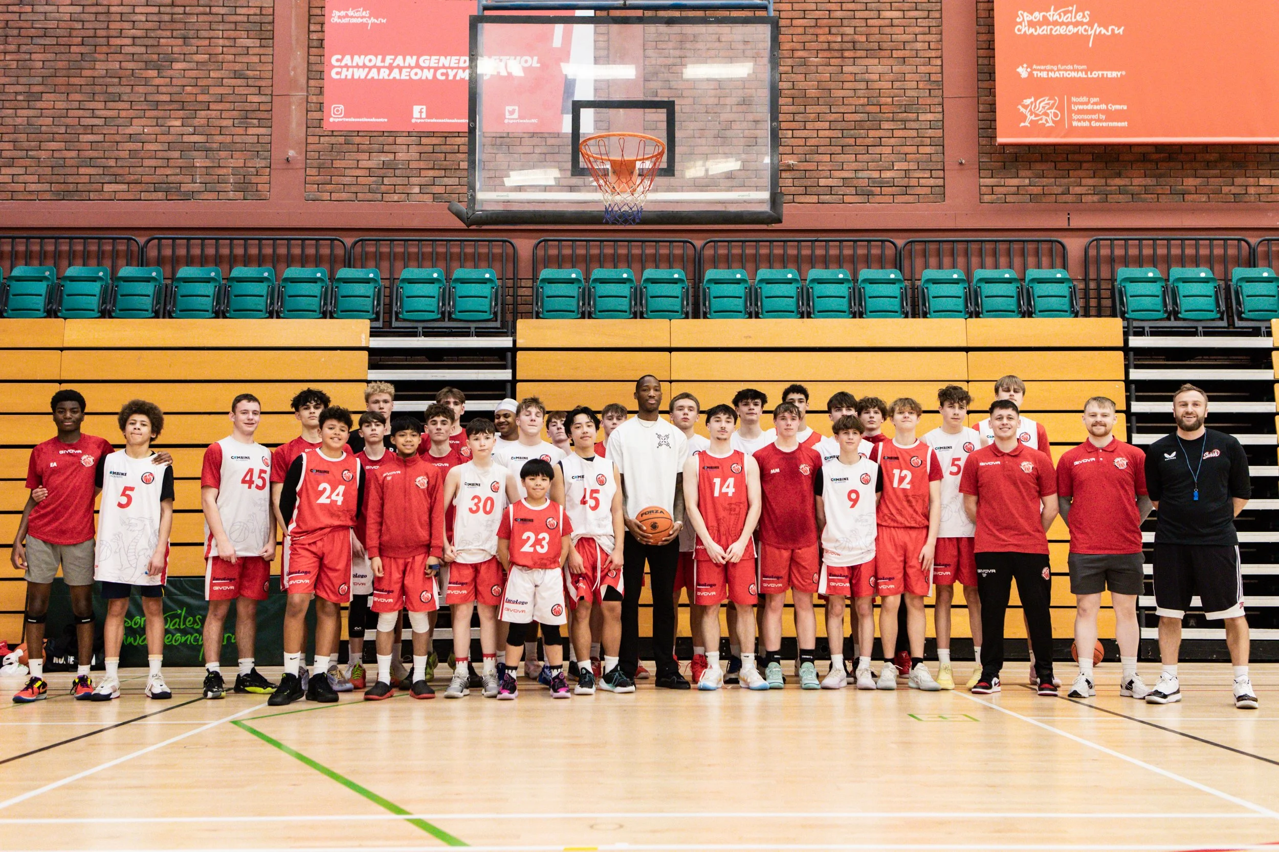 Basketball Wales players and coaches together in a sports hall
