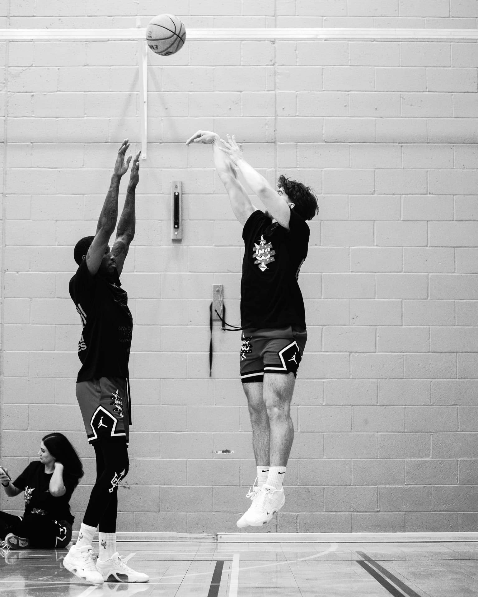 Two participants shooting during the 2025 Workout