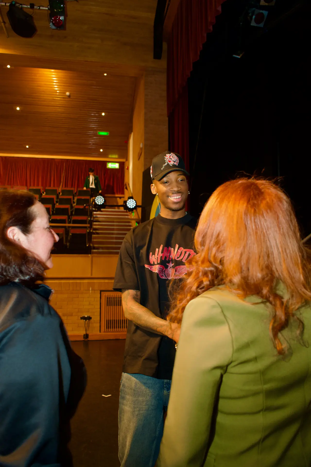 Kofi Josephs speaking with members of the Westholme community after the talk