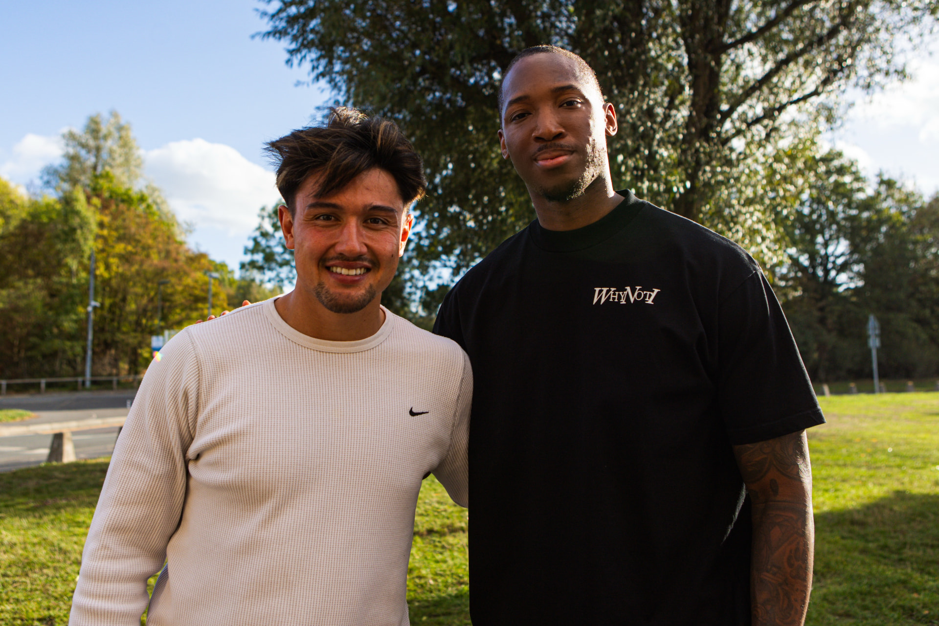 Kofi Josephs with a Harlequins player outside the club building