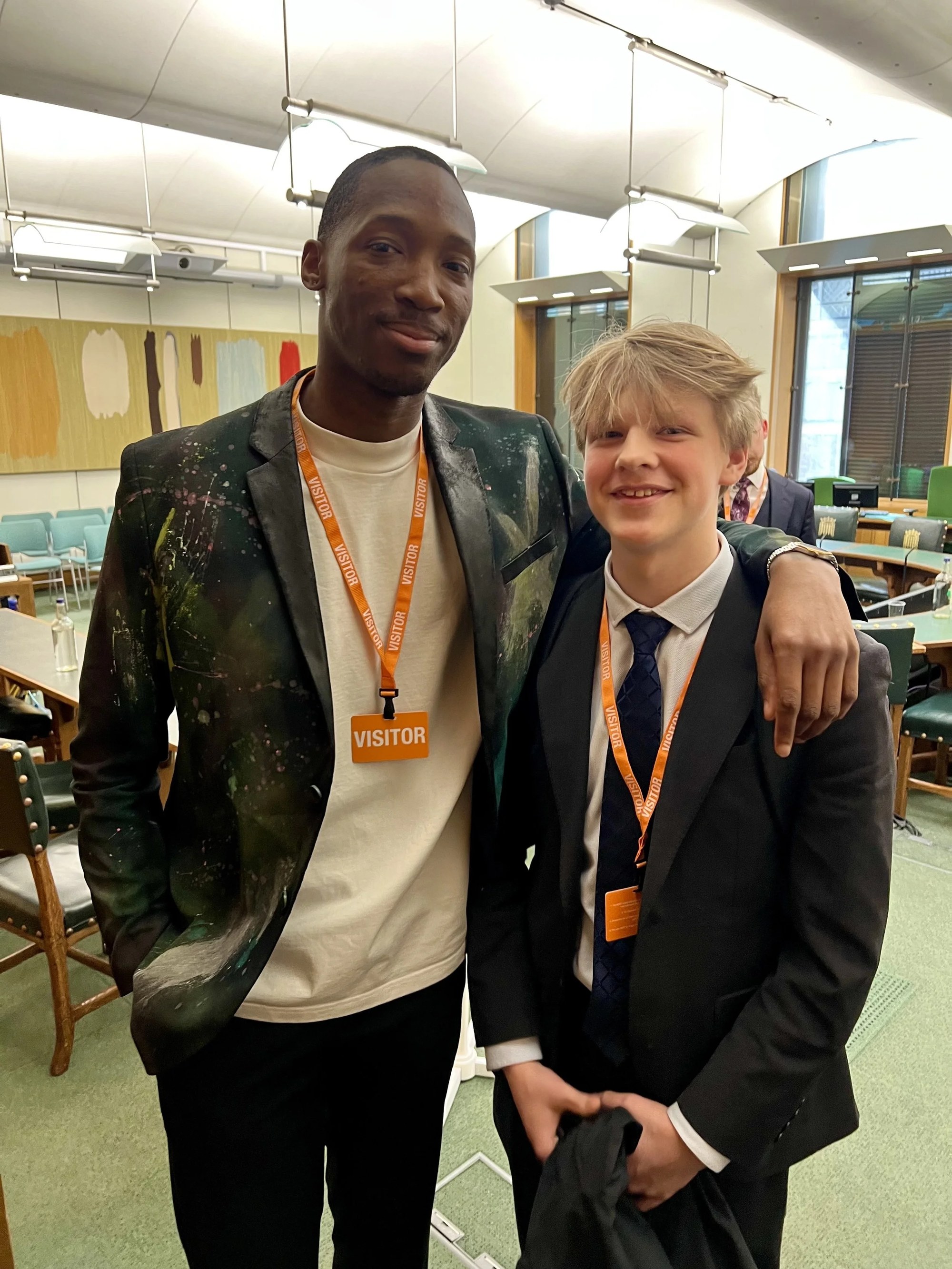 Kofi Josephs with a young programme participant inside the event venue