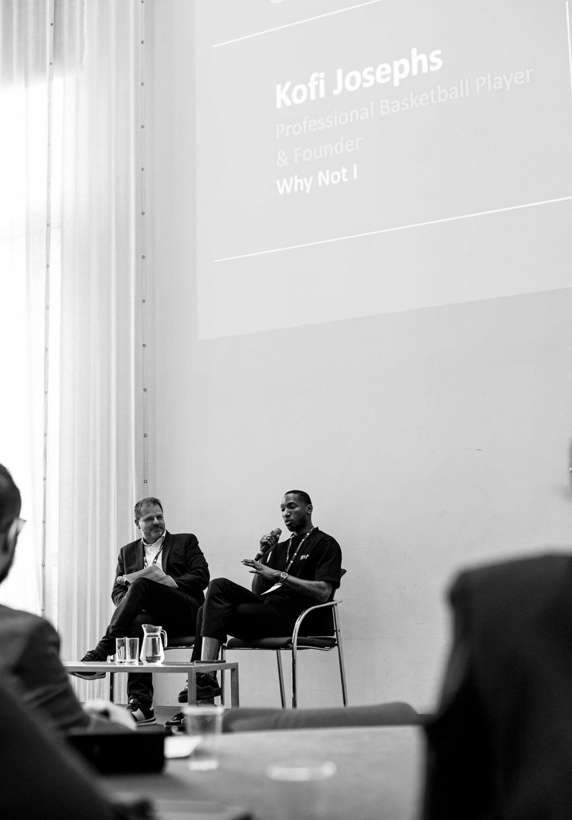 Chris Cummings and Kofi Josephs in conversation on stage at the Wellbeing at Work World Summit