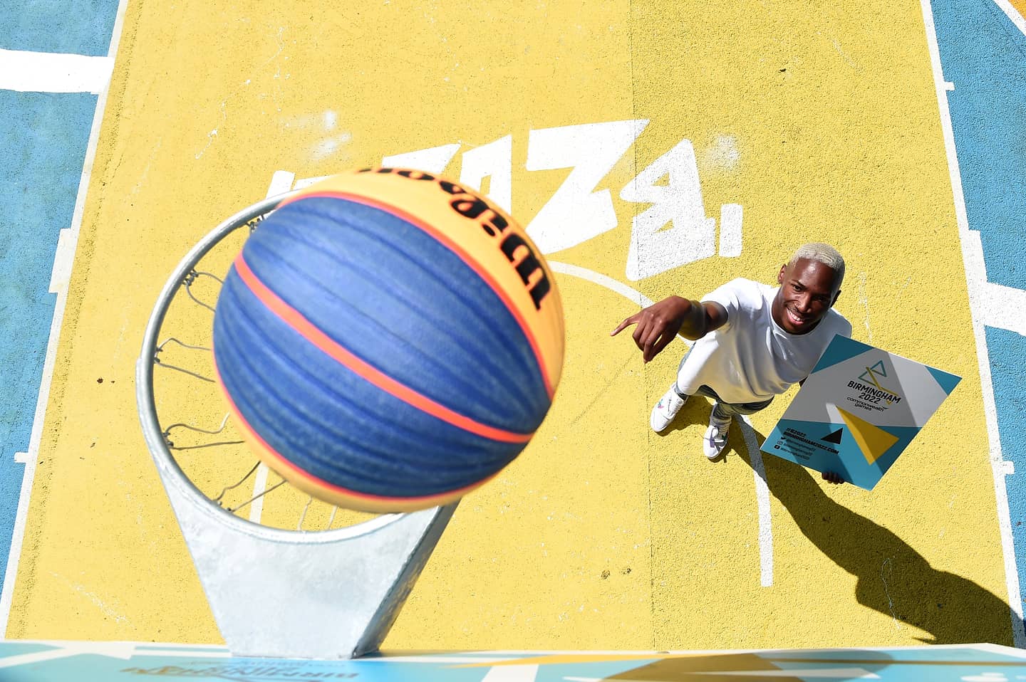 Kofi Josephs shooting towards the hoop on the colourful Summerfield Park basketball court in Birmingham