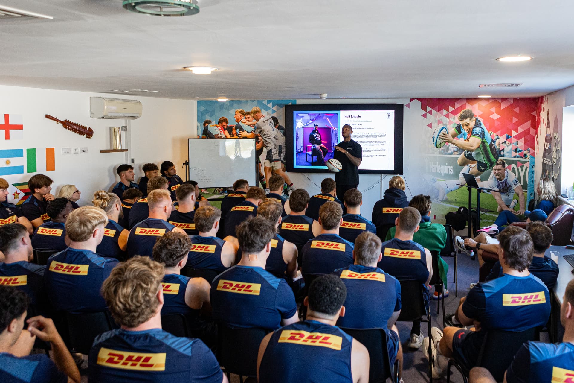 Kofi Josephs speaking to Harlequins players and staff gathered for his session