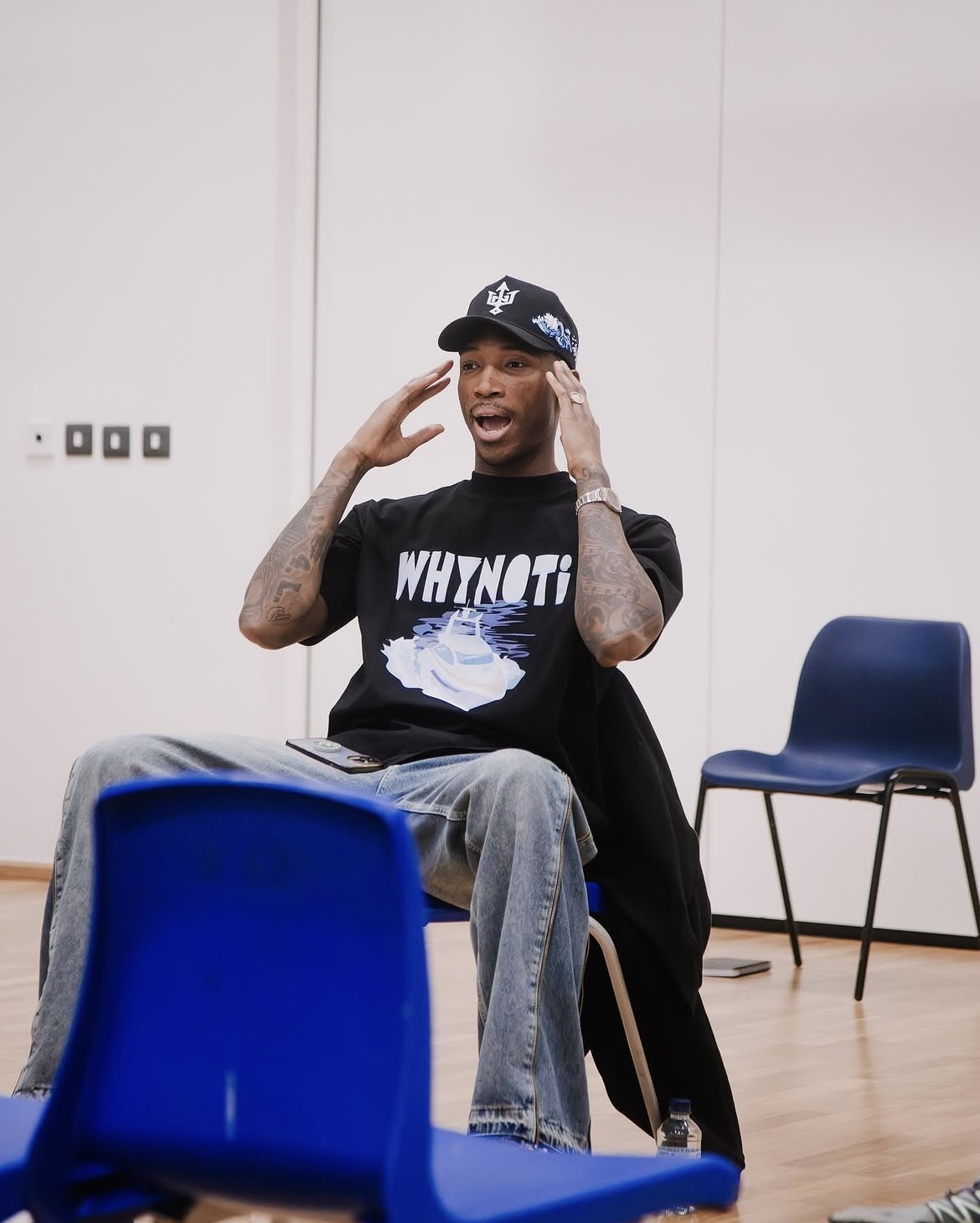 Kofi Josephs speaking during a seated school discussion