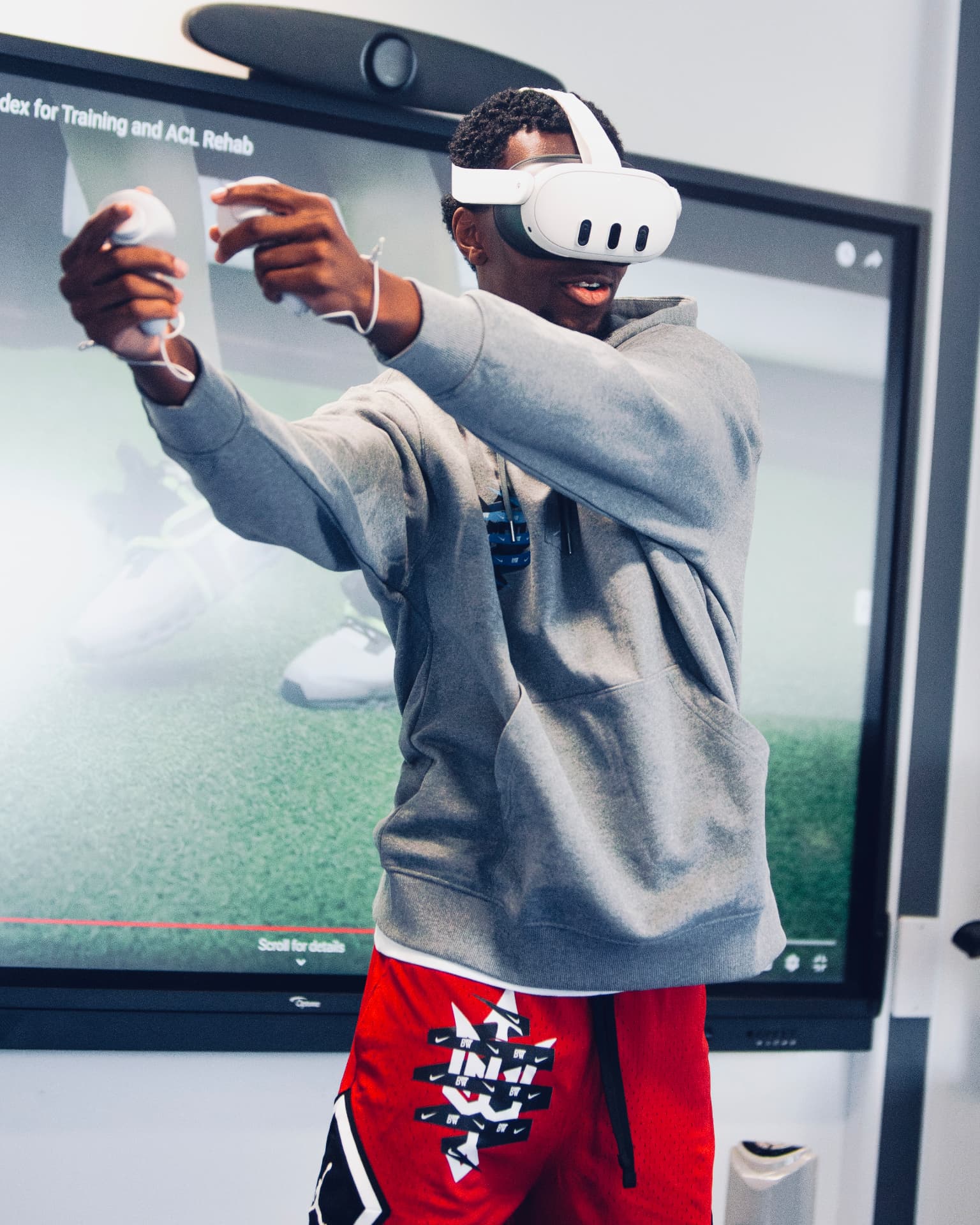 A participant using a virtual reality training headset during the 2025 Workout