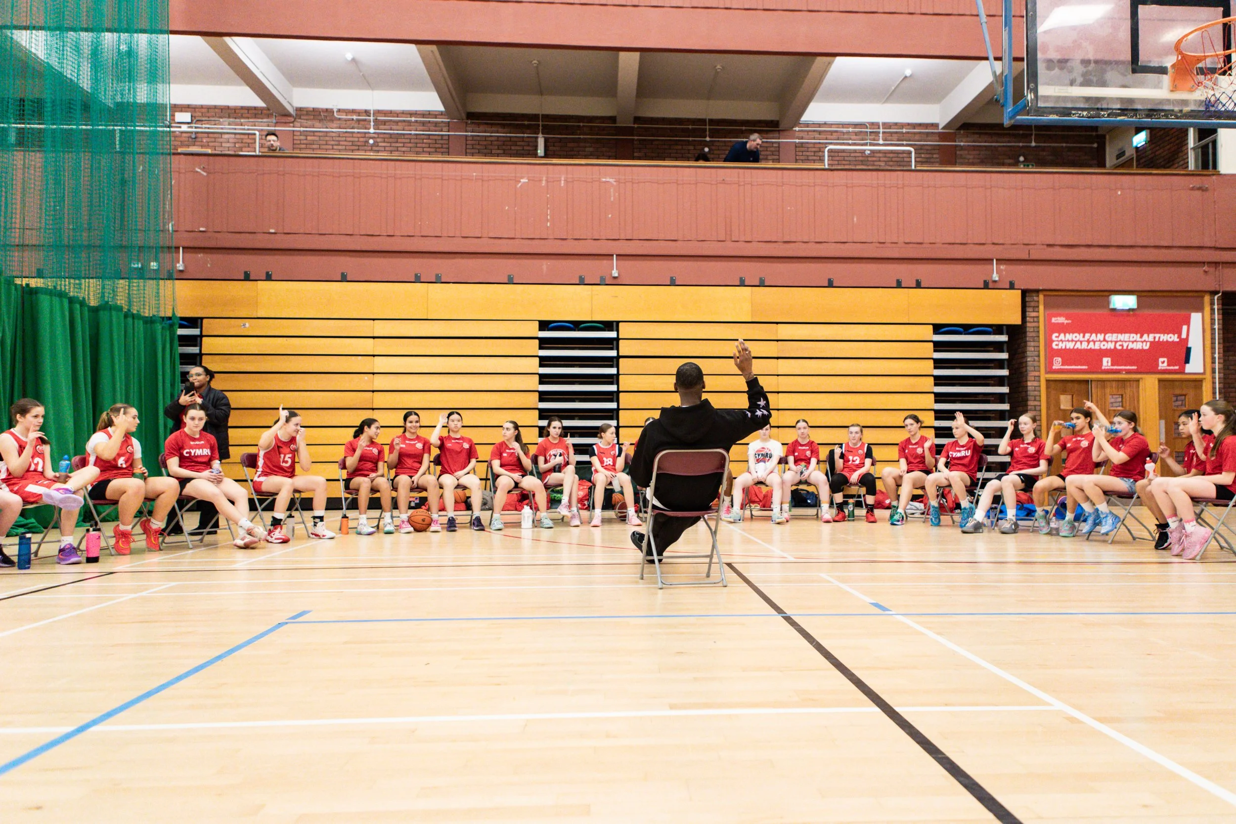 Basketball Wales players seated together during the Why Not I session
