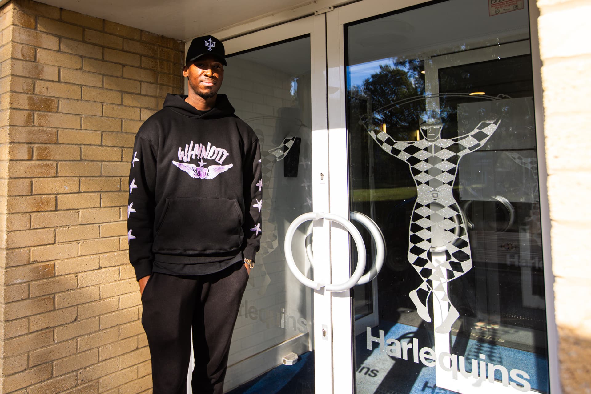 Kofi Josephs arriving at the Harlequins entrance wearing a Why Not I hoodie