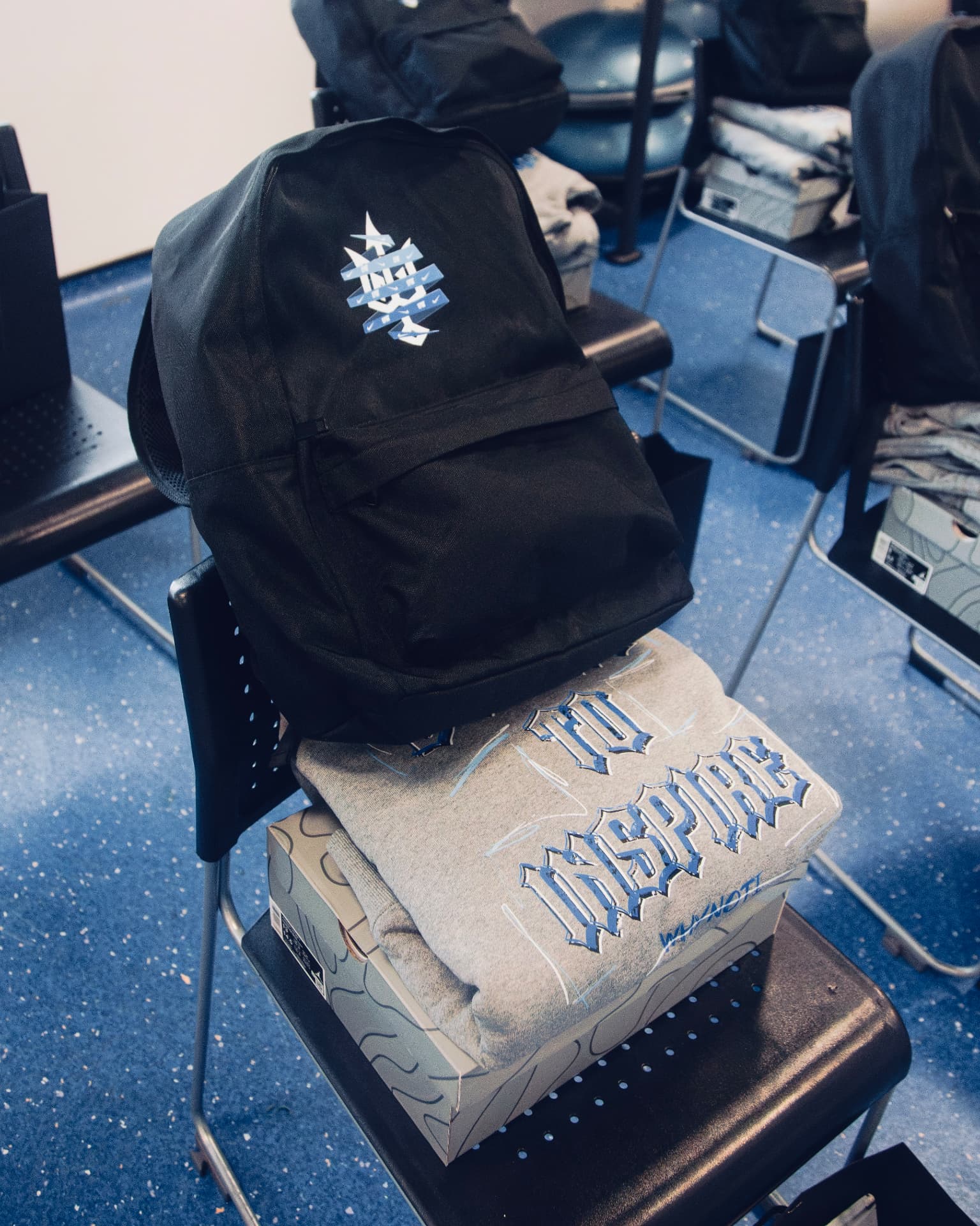 Why Not I Workout clothing, backpack and shoes prepared on a chair