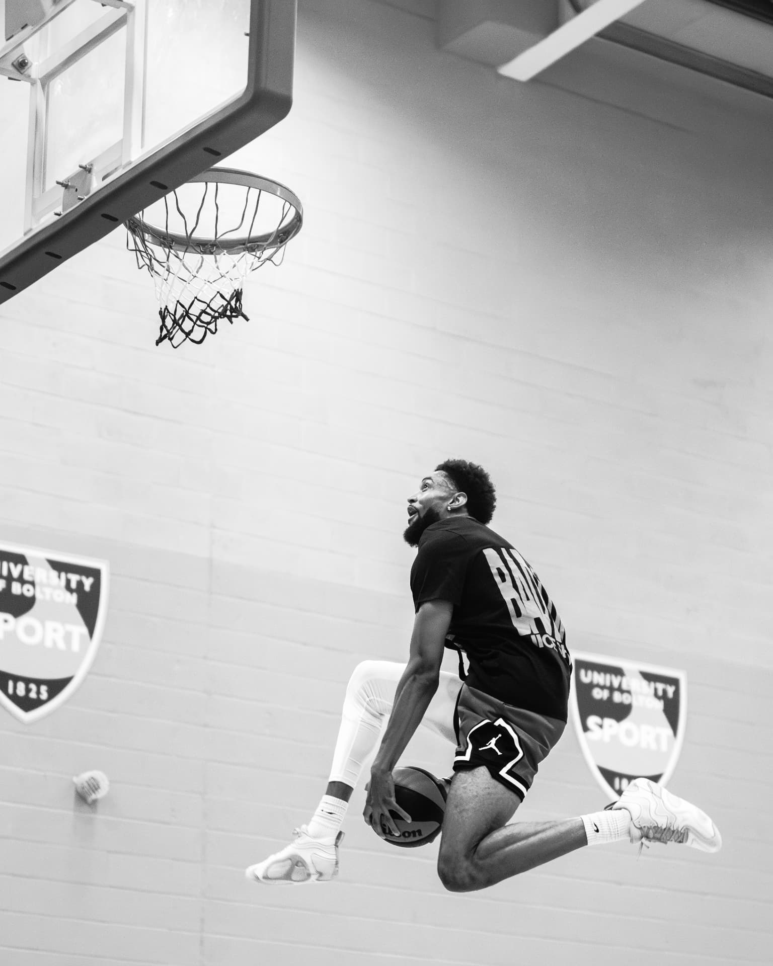A participant rising for a layup during the 2025 Workout