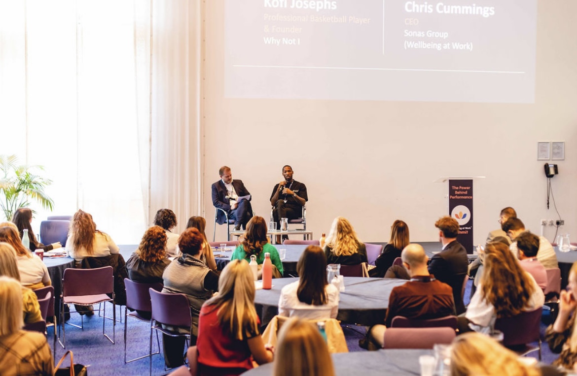 Chris Cummings hosting a fireside conversation with Kofi Josephs at the Wellbeing at Work World Summit