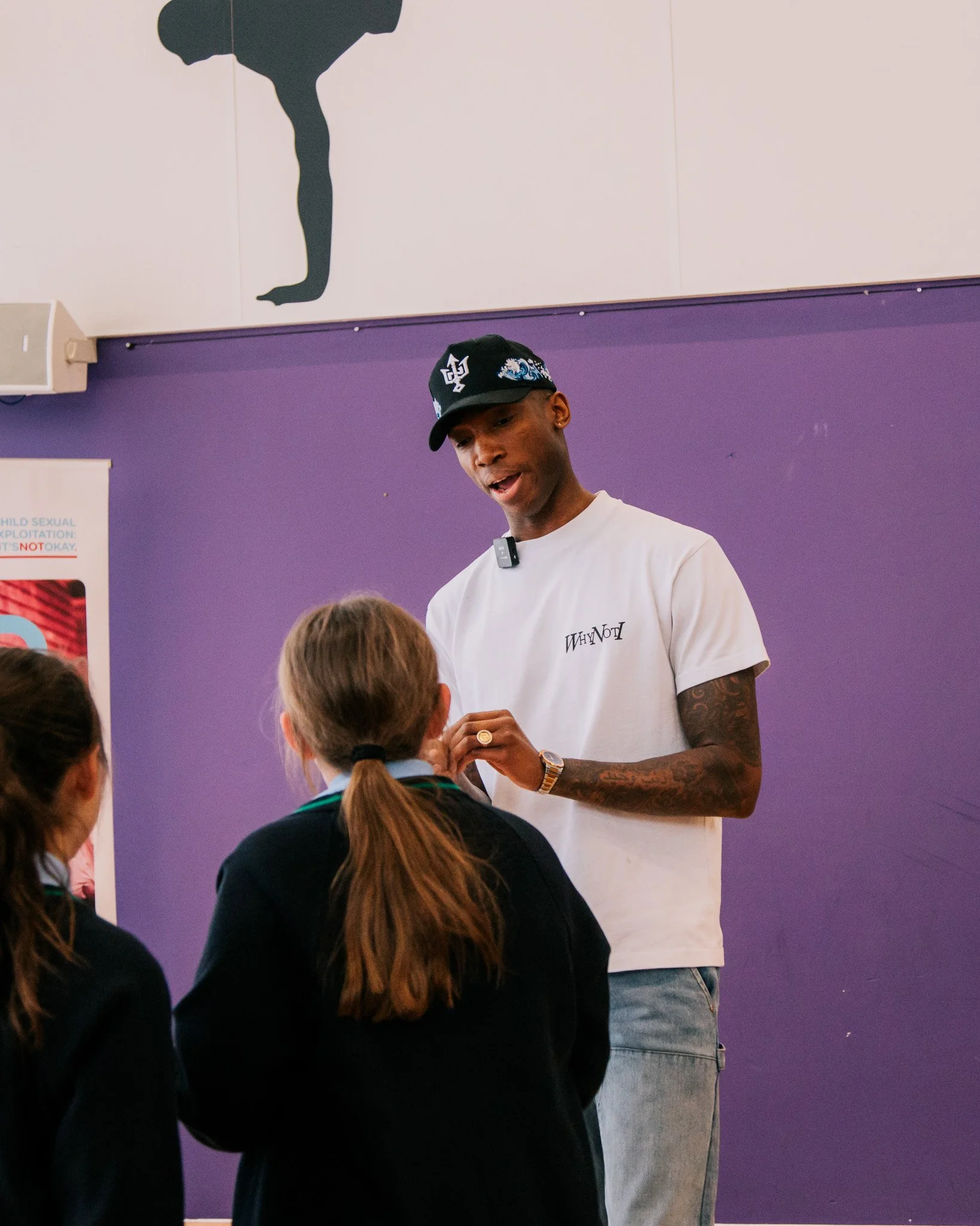 Kofi Josephs talking with a young person at Wigan Youth Zone