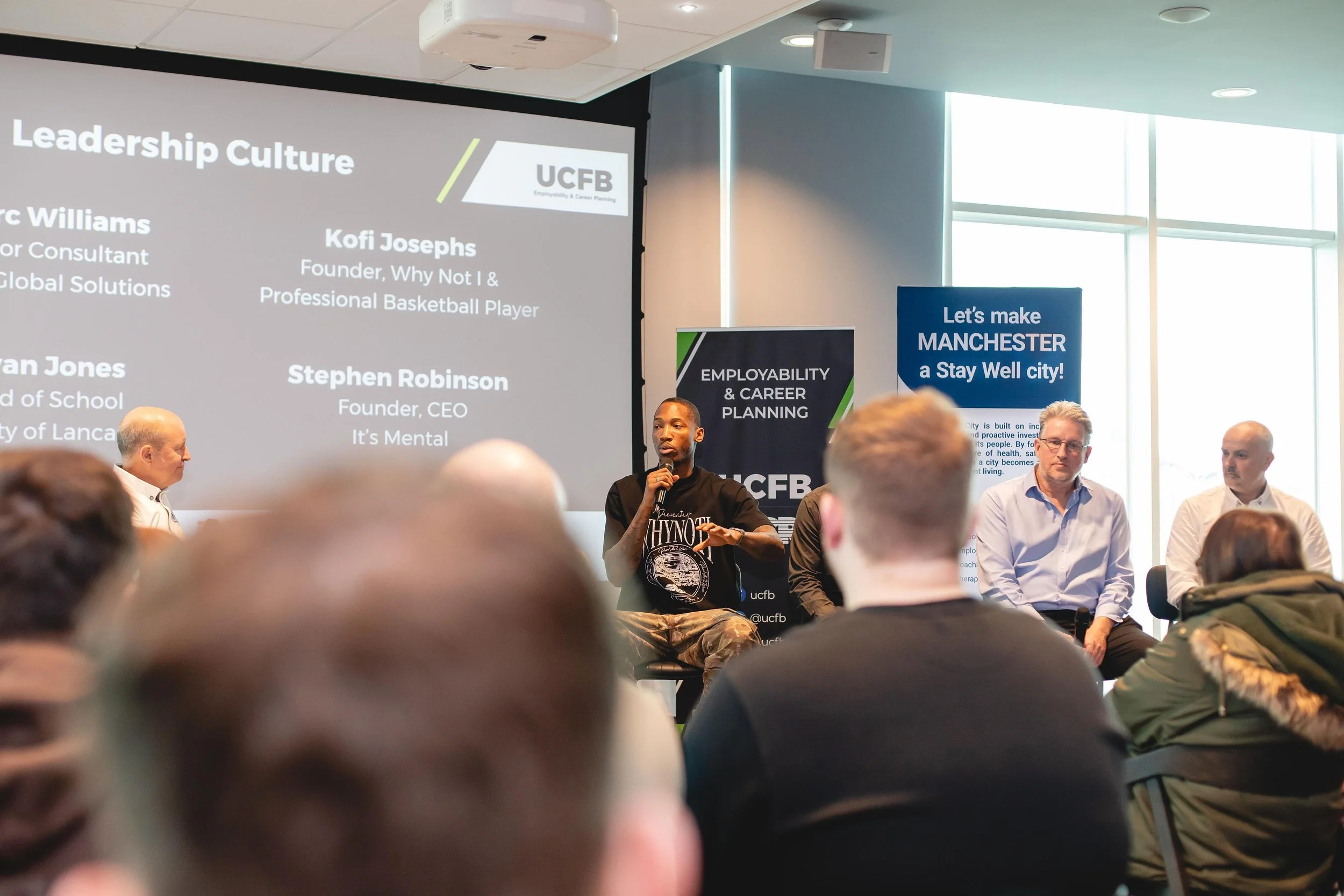 Kofi Josephs speaking during the UCFB × Manchester United conference