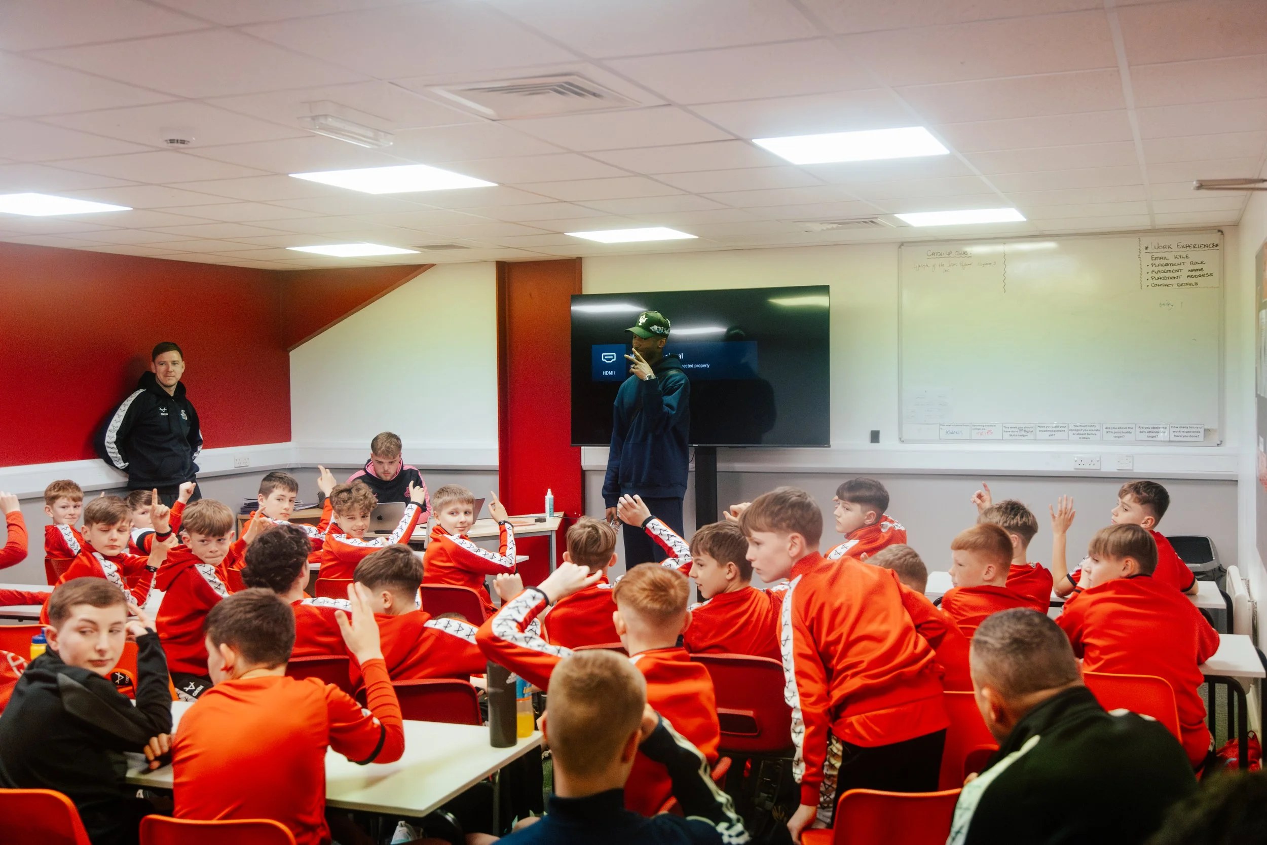 Doncaster Rovers Academy players gathered around tables during Kofi Josephs’s workshop