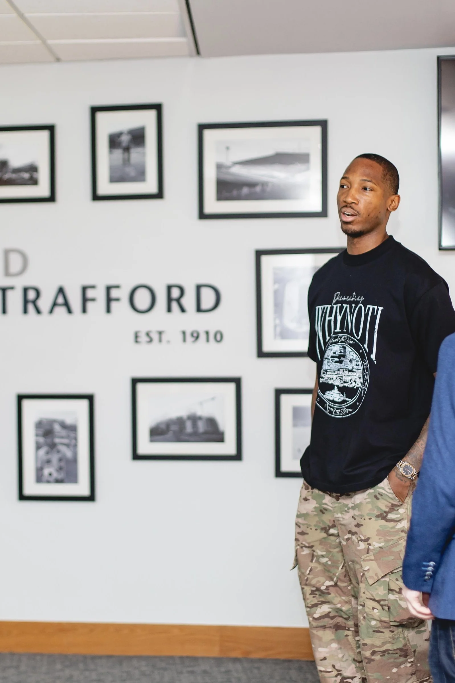 Kofi Josephs wearing a Why Not I sweatshirt at the engagement
