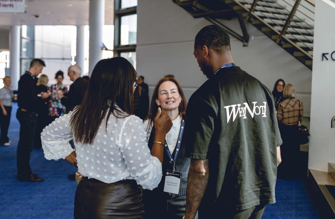 Kofi Josephs speaking with attendees after the Wellbeing at Work World Summit session