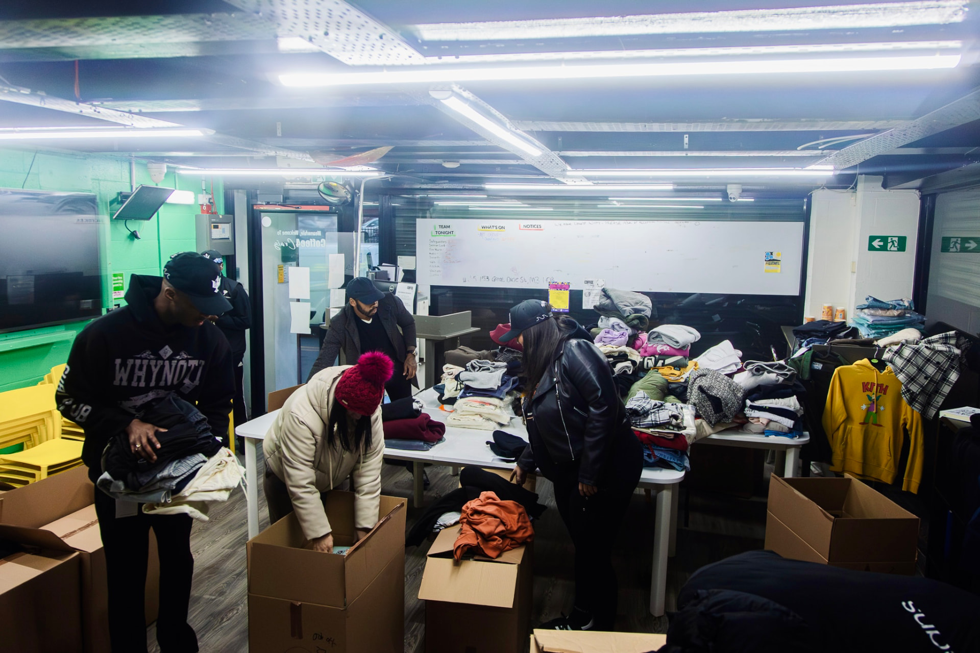 Volunteers sorting donated clothing during the Coffee 4 Craig activation